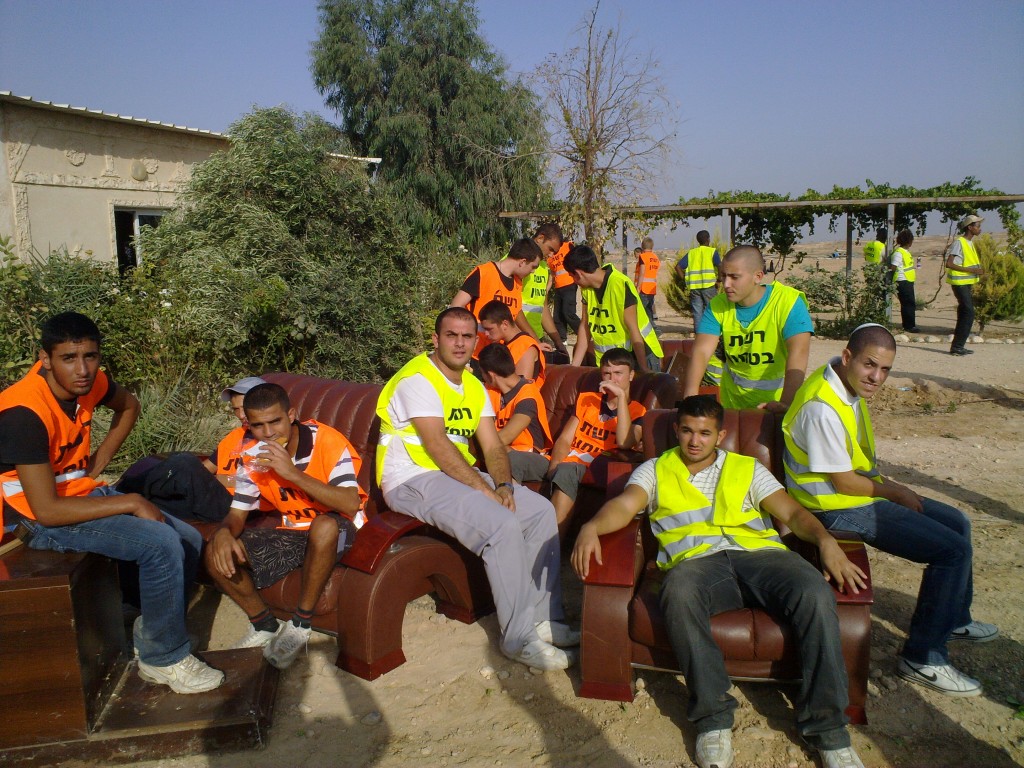 Israeli high school age police volunteers lounge on furniture taken from an al-Arakib family's home. All photos by Ata Abu Madyam of Arab Negev News.