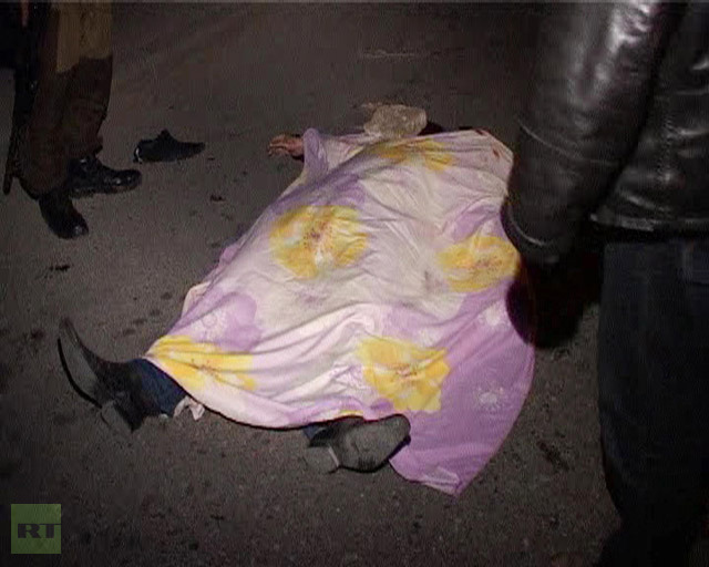 A dead body at the twin blast scene in Makhachkala (RIA Novosti / Bashir Aliyev)
