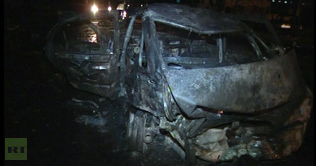 Burnt car at the twin blast scene in Makhachkala (RIA Novosti / Bashir Aliyev)